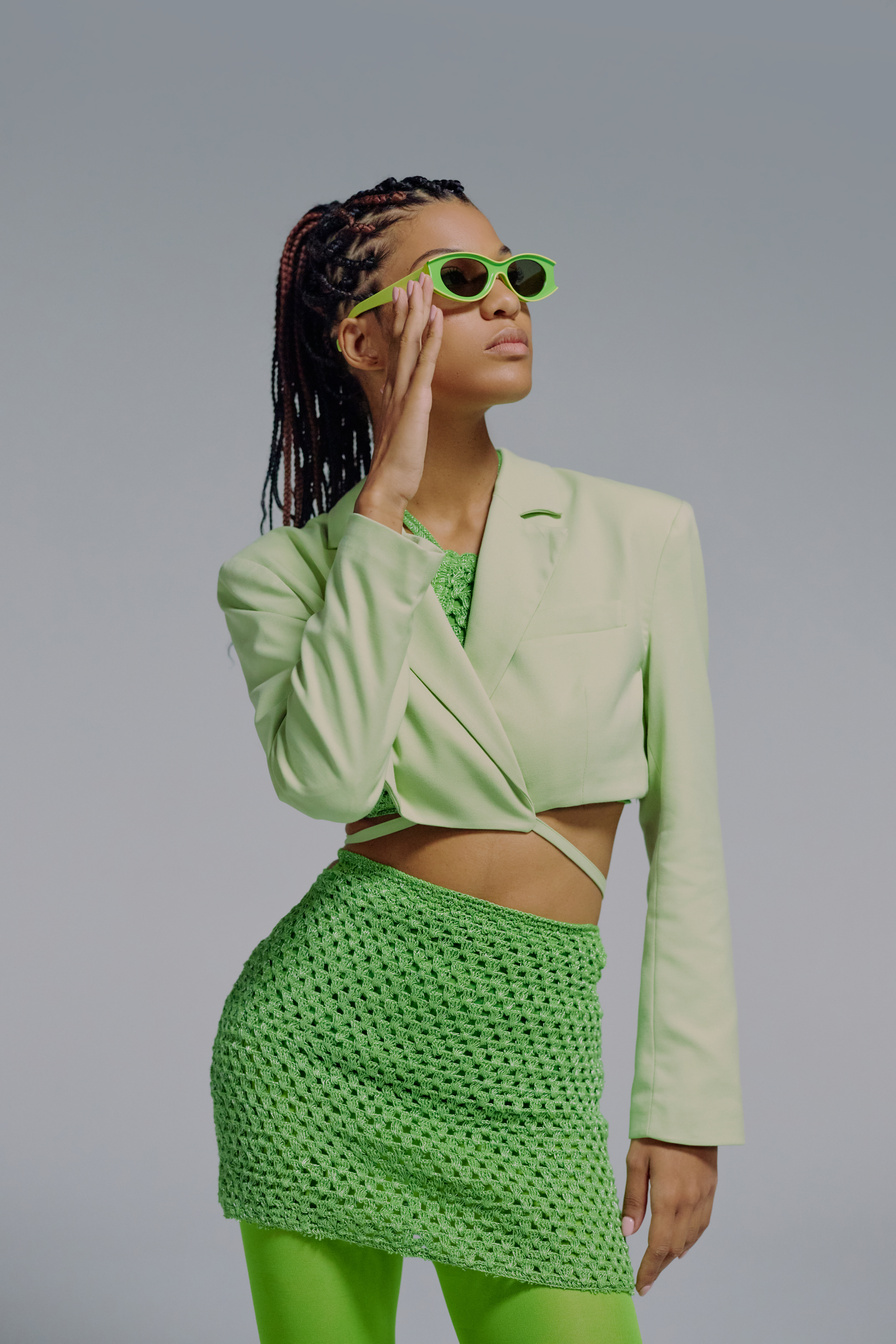 Studio portrait of woman in green clothing